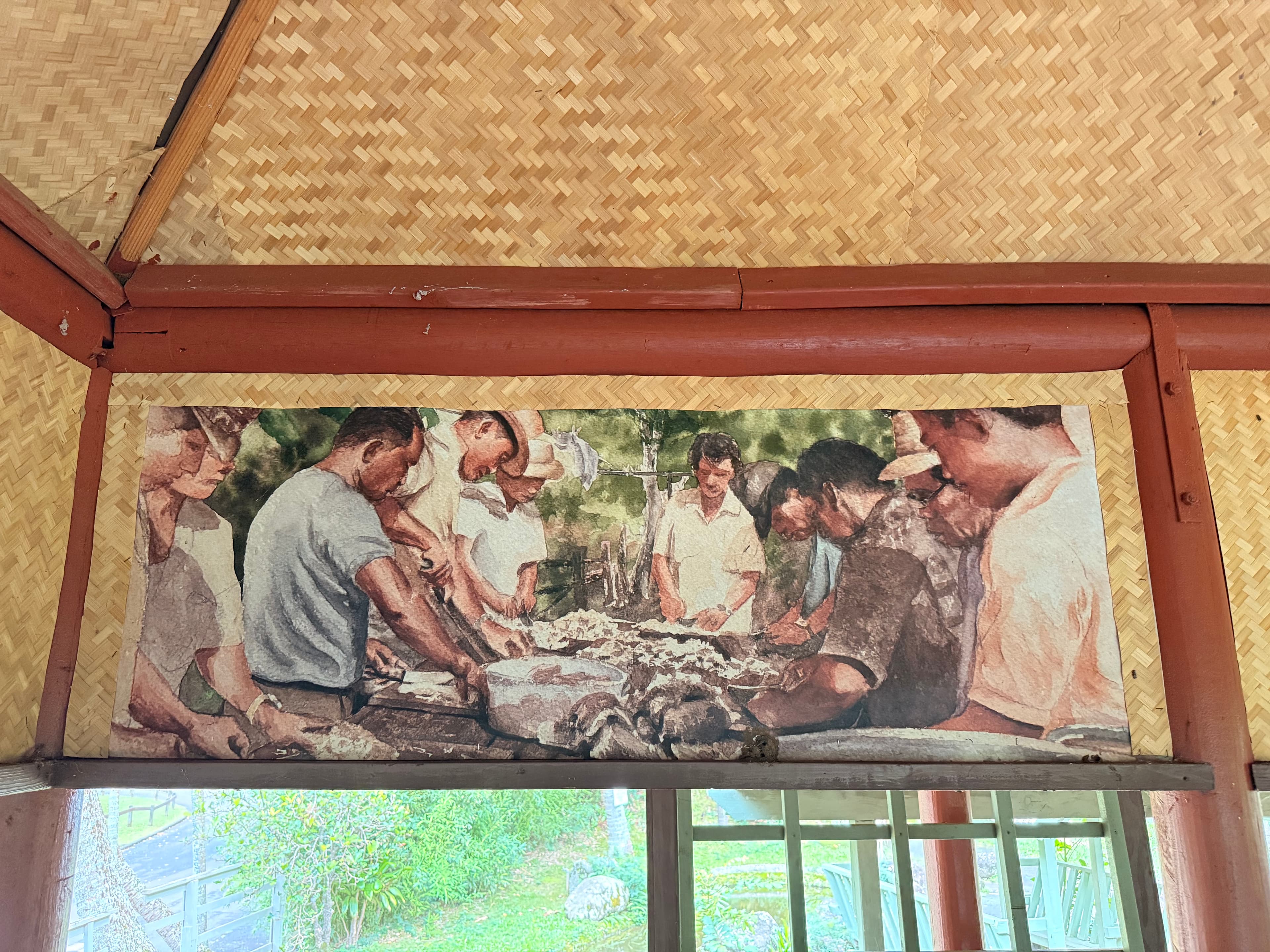 Watercolor of men gathered around a table preparing food outdoors